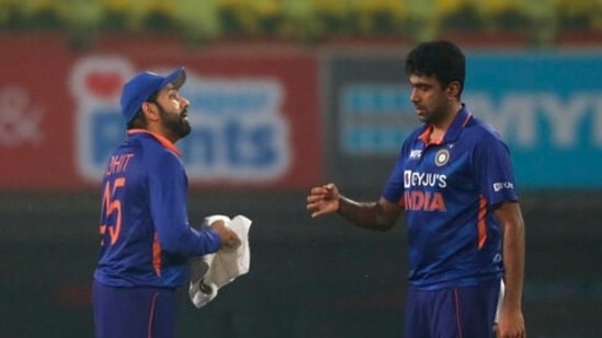 India's Ravichandran Ashwin, right, speaks with captain Rohit Sharma between overs during the second T20 cricket match between India and New Zealand, in Ranchi, India, Friday, Nov. 19, 2021. (AP)