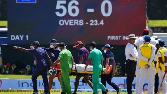 Supportive staff members carry West Indies' player Jeremy Solozano, on stretcher, to an ambulance after being hit by a shot played by Sri Lanka's Dimuth Karunaratne during the day one of the first test cricket match between Sri Lanka and West Indies' in Galle, Sri Lanka, Sunday, Nov. 21, 2021.(AP)