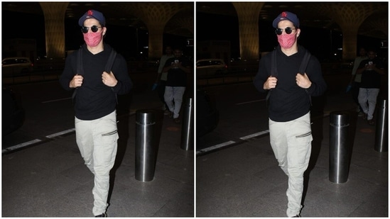 He accessorised his airport look with tinted shades and a black and white pair of sneakers.(HT Photos/Varinder Chawla)