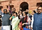 Trinamool Congress (TMC) MPs Saugata Roy, Sukhendu Sekhar Roy (R) and others ahead of meeting home minister Amit Shah, seen protesting in Parliament. (ANI Photo)
