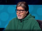 Amitabh Bachchan with a contestant on KBC 13. Amitabh Bachchan with a contestant on KBC 13.