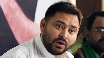 Leader of opposition Tejashwi Yadav addresses a press conference at party office in Patna on Sunday. (Santosh Kumar/HT Photo)