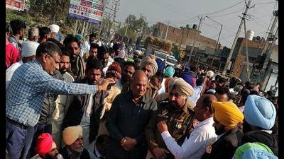 Locals protest after the accident in Moonak, Sangrur, on Monday. (HT Photo)