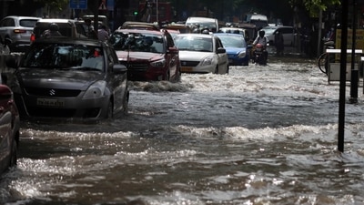 Vehicles wade through a waterlogged road following heavy rainfall, in Chennai on Monday. (ANI) Vehicles wade through a waterlogged road following heavy rainfall, in Chennai on Monday. (ANI)