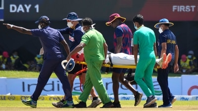 Supportive staff members carry West Indies' player Jeremy Solozano, on stretcher, to an ambulance after being hit by a shot played by Sri Lanka's Dimuth Karunaratne during the day one of the first Test. (AP)