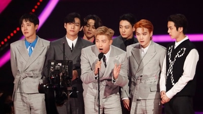 BTS received an award for Artist of the Year at the 49th Annual American Music Awards. All of them looked dapper on stage in their monochrome coloured suits. (REUTERS)