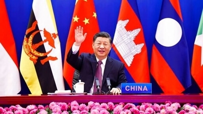 Chinese President Xi Jinping waves as he chairs the ASEAN-China Special Summit to commemorate the 30th Anniversary of ASEAN-China Dialogue Relations via video link from Beijing. (AP) Chinese President Xi Jinping waves as he chairs the ASEAN-China Special Summit to commemorate the 30th Anniversary of ASEAN-China Dialogue Relations via video link from Beijing. (AP)