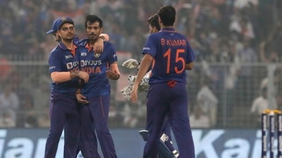 India's Yuzvendra Chahal, center without cap, celebrates with teammates the dismissal of New Zealand's Martin Guptill, second left, during the third Twenty20 cricket match between India and New Zealand in Kolkata, India, Sunday, Nov. 21, 2021. (AP Photo/Bikas Das) (AP) India's Yuzvendra Chahal, center without cap, celebrates with teammates the dismissal of New Zealand's Martin Guptill, second left, during the third Twenty20 cricket match between India and New Zealand in Kolkata, India, Sunday, Nov. 21, 2021. (AP Photo/Bikas Das) (AP)