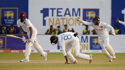 Sri Lanka's Oshada Fernando, second left, takes a catch to dismiss West Indies' batsman Roston Chase (AP) Sri Lanka's Oshada Fernando, second left, takes a catch to dismiss West Indies' batsman Roston Chase (AP)