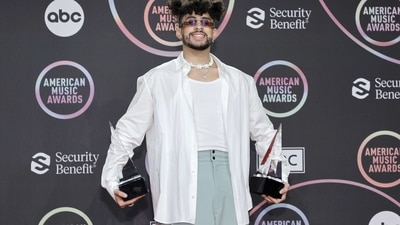 Bad Bunny, winner of the Favourite Male Latin Artist award, poses in the press room in his funky attire. (AFP) Bad Bunny, winner of the Favourite Male Latin Artist award, poses in the press room in his funky attire. (AFP)
