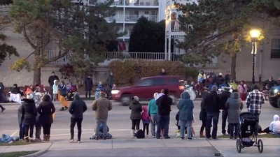 A red SUV speeds past attendees moments before plowing into a crowd at a Christmas parade in Waukesha, Wisconsin, US. (CITY OF WAUKESHA via REUTERS)