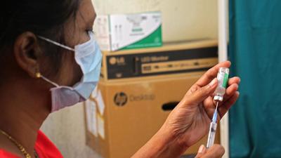 Health worker prepares Covid vaccine dose at a vaccination centre in Pune, on November 21. As of Monday, Pune district has reported 128 new Covid-19 cases and one death due to the infection. (RAVINDRA JOSHI/HT)