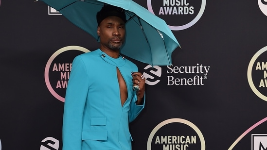 Billy Porter aces the blue umbrella hate look as he arrives at the American Music Awards.(Invision)