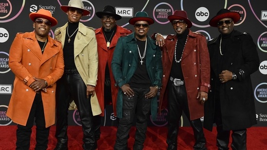 Michael Bivins, Ronnie Devoe, Bobby Brown, Ricky Bell, Ralph Tresvant and Johnny Gill of New Edition pose in the press room at the American Music Awards.(Invision)