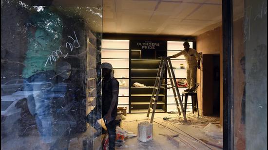 A liquor store being revamped in Greater Kailash-2 on Monday. (Raj K Raj/HT)