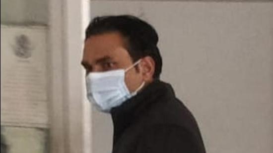 Haryana Public Service Commission (HPSC) deputy secretary Anil Nagar, who along with two others was arrested for tampering with the marks of candidates of dental surgeons’ exam, to his office to conduct more searches. (HT Photo)