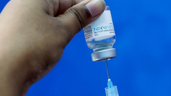 A healthcare worker fills a syringe with a dose of Covaxin at a municipal health centre in Kolkata.(AP File Photo)