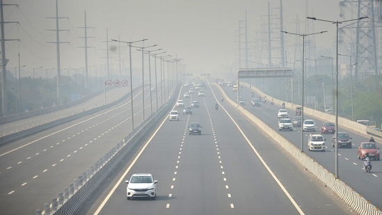 Vehicles ply on Delhi-Meerut Expressway amid low visibility due to a thick layer of smog in Ghaziabad. (PTI Photo)