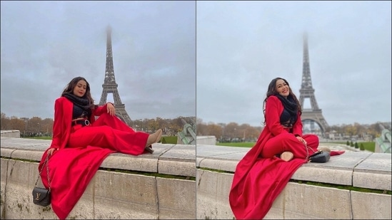 Striking happy poses as she sat on a wall with the Eiffel Tower visible amid the fog in the backdrop, Neha captioned the pictures, “Sending Love from the City of Love #Paris (sic).”(Instagram/nehakakkar)