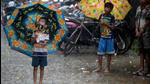 Children look on amid a heavy downpour in Mumbai on August 31, 2021. The congested and waterlogging-prone city is home to leptospirosis, a disease that comes from Mumbai’s huge rat population. (AFP/File) Children look on amid a heavy downpour in Mumbai on August 31, 2021. The congested and waterlogging-prone city is home to leptospirosis, a disease that comes from Mumbai’s huge rat population. (AFP/File)