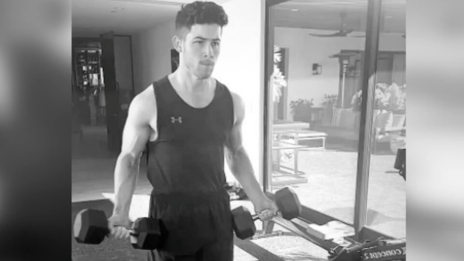 Nick jonas flexing 8 pack abs and huge biceps on Craiyon