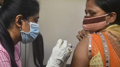 A health worker administers a dose of Covid-19 vaccine to a beneficiary at a vaccination centre in Kolkata. The West Bengal government is freeing up beds reserved for Covid-19 patients as daily coronavirus cases are coming down. (PTI/File) A health worker administers a dose of Covid-19 vaccine to a beneficiary at a vaccination centre in Kolkata. The West Bengal government is freeing up beds reserved for Covid-19 patients as daily coronavirus cases are coming down. (PTI/File)
