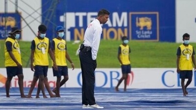 Kumar Dharmasena inspects the field after a spell of rain interrupted the play during the day three of their first Test match between Sri Lanka and West Indies (AP) Kumar Dharmasena inspects the field after a spell of rain interrupted the play during the day three of their first Test match between Sri Lanka and West Indies (AP)
