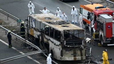 Officials work at the site of a bus accident, in which at least 46 people were killed, on a highway near the village of Bosnek, south of Sofia, on November 23, 2021. (AFP) Officials work at the site of a bus accident, in which at least 46 people were killed, on a highway near the village of Bosnek, south of Sofia, on November 23, 2021. (AFP)