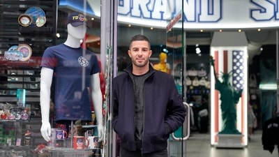 David Cohen, an owner of Grand Slam, a souvenir and sports apparel store at Times Square, has been yearning for a return to the days when business boomed at his family's souvenir shop. (AP) David Cohen, an owner of Grand Slam, a souvenir and sports apparel store at Times Square, has been yearning for a return to the days when business boomed at his family's souvenir shop. (AP)