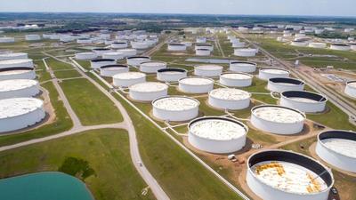 Crude oil storage tanks at the Cushing oil hub in Cushing, Oklahoma, US. The Biden administration has announced the release of 50mn barrels of crude from the country’s strategic reserve to tackle high prices. The White House said this action was taken in “parallel” with countries such as India, China, Japan, South Korea and the UK. (REUTERS) Crude oil storage tanks at the Cushing oil hub in Cushing, Oklahoma, US. The Biden administration has announced the release of 50mn barrels of crude from the country’s strategic reserve to tackle high prices. The White House said this action was taken in “parallel” with countries such as India, China, Japan, South Korea and the UK. (REUTERS)