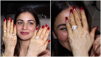Shraddha Arya shows her henna-decorated hands and engagement ring. Shraddha Arya shows her henna-decorated hands and engagement ring.