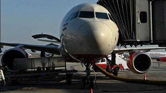 An Air India aircraft on the tarmac at the Indira Gandhi International airport in New Delhi on October 8, 2021. Air India’s board members have been asked to resign ahead of the airline’s takeover by Tata Sons., according to sources. (AFP/File)