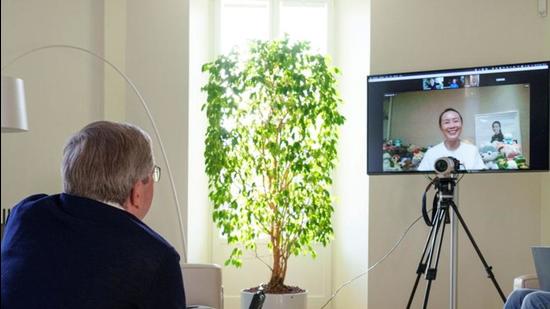 Chinese tennis player Peng Shuai seen on screen during a virtual discussion with International Olympic Committee (IOC) President Thomas Bach in Lausanne, Switzerland. (REUTERS)