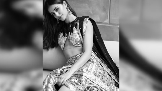 Ananya Panday is here to take your breath away in a cutaway sequins blouse, lehenga and dupatta.(Instagram/@ananyapanday)