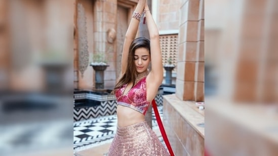 Ananya Panday shines bright like a diamond as she poses for the camera in a pink sequins lehenga set by Manish Malhotra.(Instagram/@ananyapanday)