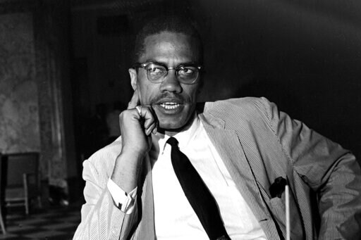 Malcolm X speaks at a news conference in the Hotel Theresa, in New York, on May 21, 1964. (AP Photo, File)
