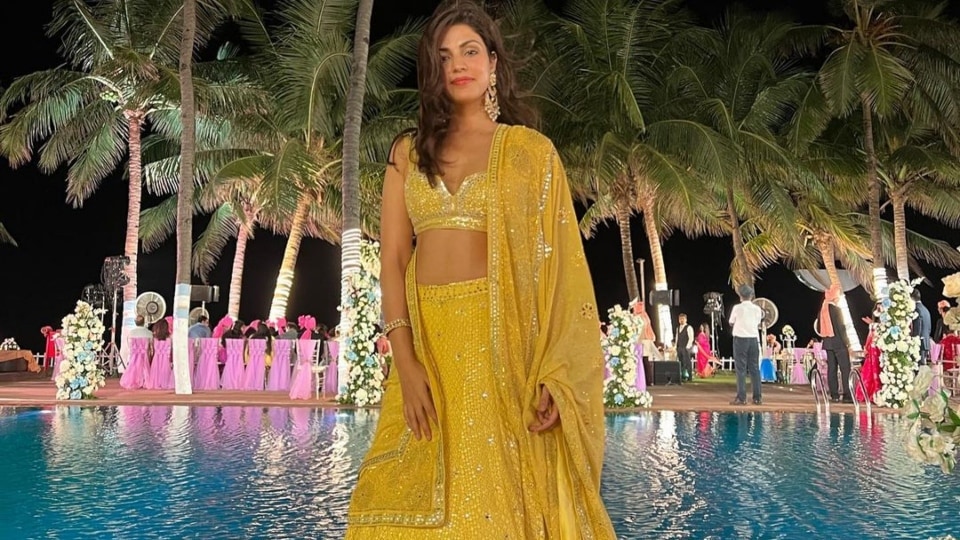 Rhea Chakraborty in a yellow embroidered lehenga set.&nbsp;