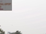 A signboard points towards the Noida International Jewar Airport. A signboard points towards the Noida International Jewar Airport.