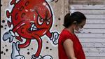 A woman walks past a Covid-awareness graffiti in Mumbai, India. (REUTERS/File) A woman walks past a Covid-awareness graffiti in Mumbai, India. (REUTERS/File)