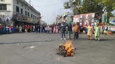 National Health Mission (NHM) workers seeking regularisation burn an effigy during a protest in Sangrur.