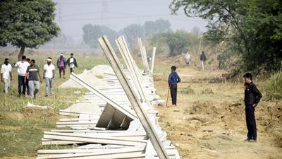 The 44.26 acres, where the waste-to-energy plant is to come up, belongs to the corporation. Two days ago, it started the construction of the boundary wall to secure the site (Sakib Ali/HT photo) The 44.26 acres, where the waste-to-energy plant is to come up, belongs to the corporation. Two days ago, it started the construction of the boundary wall to secure the site (Sakib Ali/HT photo)
