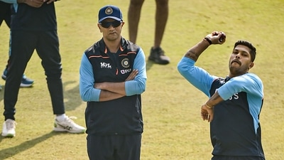 India's Umesh Yadav bowls as coach Rahul Dravid looks on, during a practice session ahead of their first cricket test match against New Zealand, in Kanpur, Wednesday. (PTI) India's Umesh Yadav bowls as coach Rahul Dravid looks on, during a practice session ahead of their first cricket test match against New Zealand, in Kanpur, Wednesday. (PTI)
