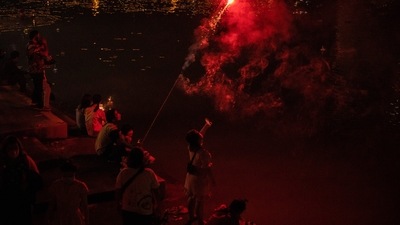 Visitors set off fireworks at the Ping River during the Loy Krathong festival in Chiang Mai, Thailand. (Bloomberg)