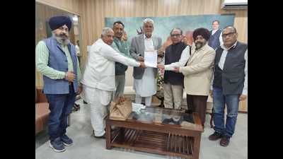 A delegation of industrialists from Ludhiana handing over a memorandum to Union minister Parshotyam Rupala in Delhi seeking a rollback of hike in GST on textiles on Wednesday. (HT photo) A delegation of industrialists from Ludhiana handing over a memorandum to Union minister Parshotyam Rupala in Delhi seeking a rollback of hike in GST on textiles on Wednesday. (HT photo)
