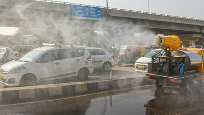 An anti-smog gun sprays water droplets to curb air pollution along the New Delhi-Gurugram expressway on Wednesday. (PTI) An anti-smog gun sprays water droplets to curb air pollution along the New Delhi-Gurugram expressway on Wednesday. (PTI)