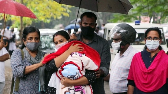 Anupama and her husband Ajith walkout from the Vanchiyoor court, with their one year old son Aiden after Family court ordered to Hand over the Child to Biological Mother, in Thiruvananthapuram on Wednesday. (KB Jayachandran)