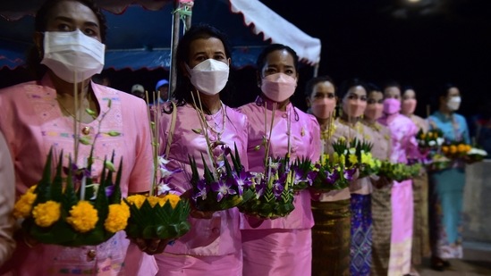 Women in traditional attires, hold krathongs in the southern Thai province of Narathiwat to mark Loy Krathong, an annual festival in which floating decorative rafts are released into rivers and ponds across the country during the evening of the full moon of the 12th Thai lunar month. (AFP)