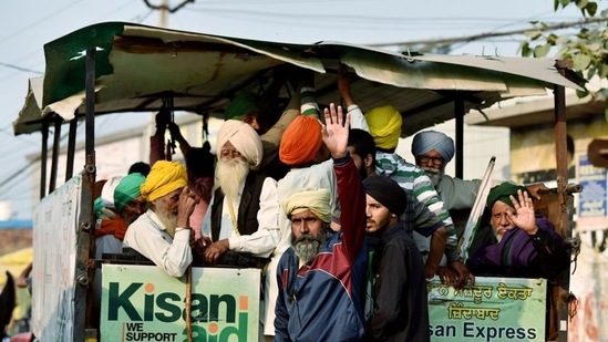 Farmers sitting on a tractor shout slogans during celebrations at Singhu Border, in New Delhi on Saturday.&nbsp;(File Photo)