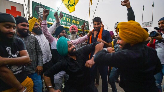 Farmers dance as they celebrate after Prime Minister Narendra Modi announced the repealing of the three central farm laws at the Singhu border in New Delhi.&nbsp;(File Photo / PTI)