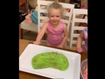 The happy birthday girl, the last one in frame - in awe of her cucumber-themed birthday cake. (instagram/@emjdahlgren) The happy birthday girl, the last one in frame - in awe of her cucumber-themed birthday cake. (instagram/@emjdahlgren)